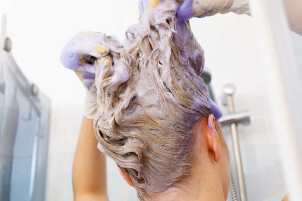 Purple shampoo can be used to neutralize pink hair