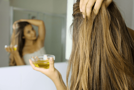 You can use Olive Oil to tone down hair color that is too bright