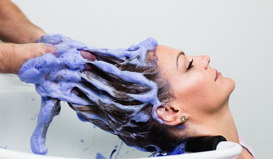 Don't keep blue shampoo in your hair for too long 