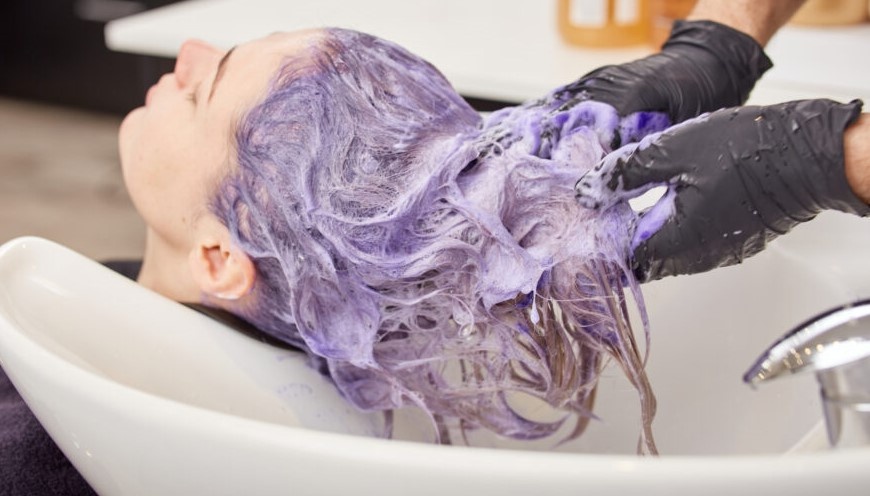 Shower with blue shampoo and/or purple shampoo only once a week to keep your hair from drying out